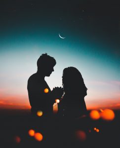 a man and woman kissing