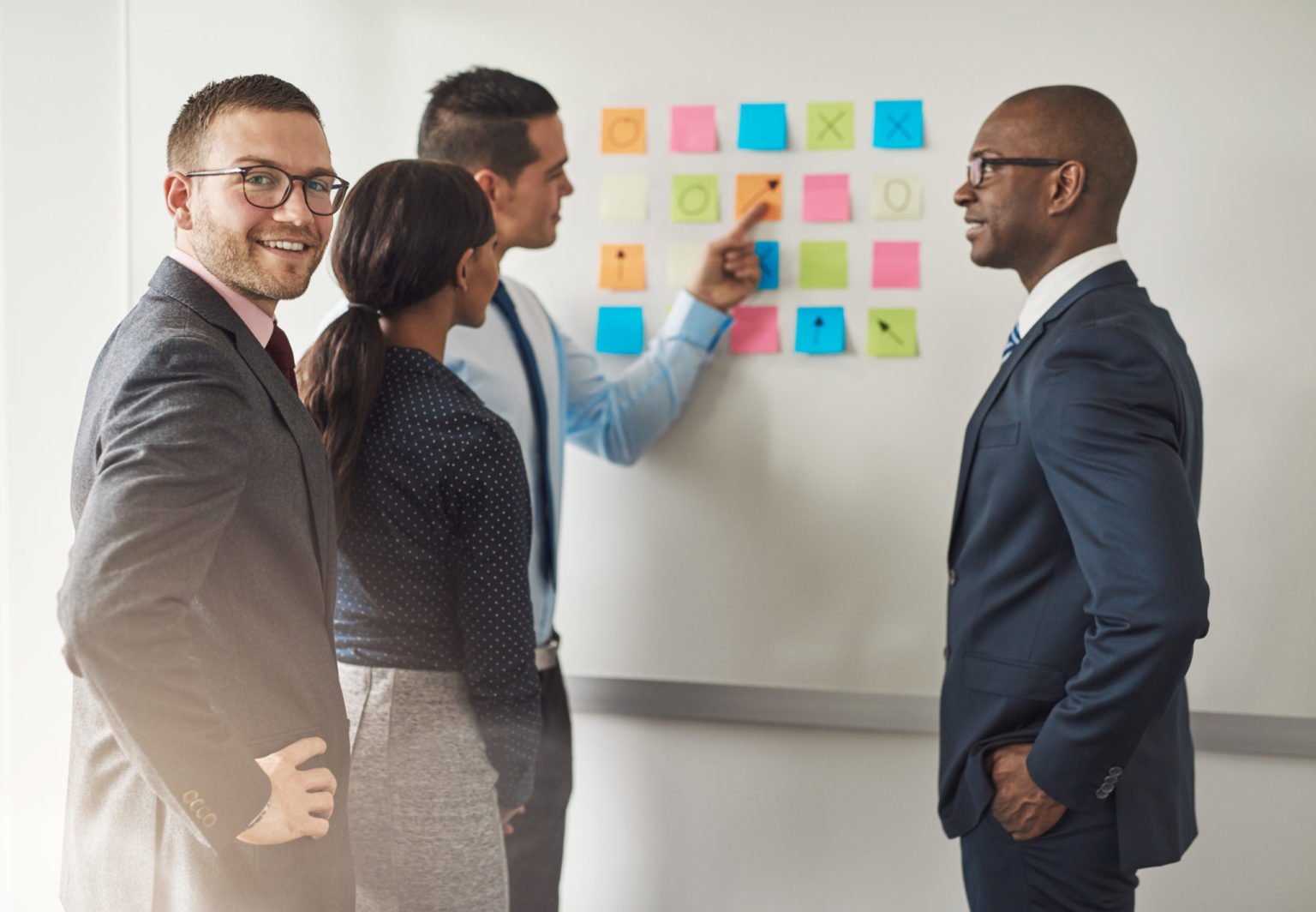 Group of businesspeople solving a puzzle