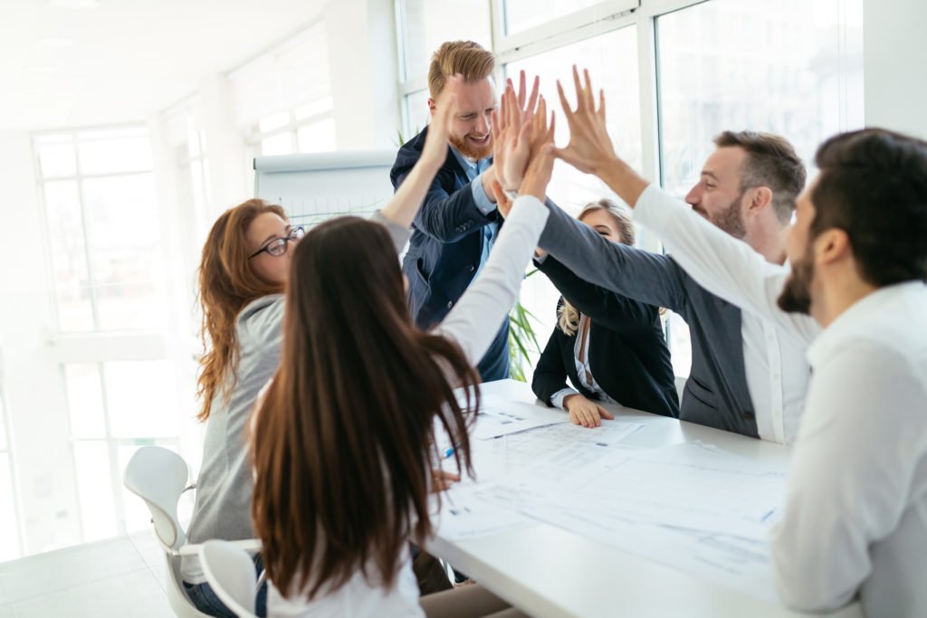 a group of people in a meeting