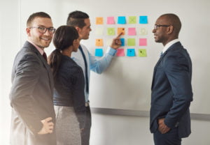 Group of businesspeople solving a puzzle